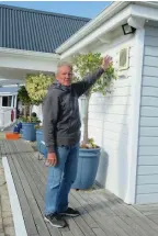  ??  ?? Vice-commodore of the Knysna Yacht Club, Michael Jacobs, points at the spotlights he has had to install.