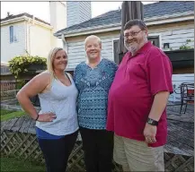  ?? MIKE MANTUCCA / CHICAGO TRIBUNE ?? Wendy Filip, center, with daughter Kristin and husband Joe, had to pick up the pieces after Joe Filip’s mother killed herself rather than comply with her doctor’s ultimatum to quit smoking. She thinks smoking should be illegal.