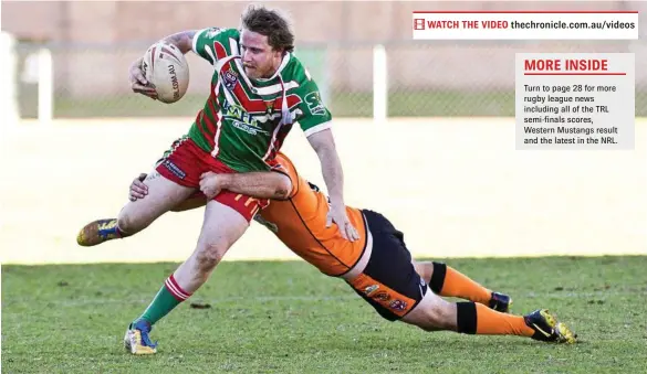  ??  ?? EVASIVE ACTION: Pittsworth centre Tim Phipps tries to escape the Souths defence. PHOTO: NEV MADSEN