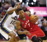  ?? JEFFREY SWINGER/USA TODAY SPORTS ?? Raptors guard Kyle Lowry, who finished with 20 points, works around Alec Burks of the Jazz on Wednesday night.