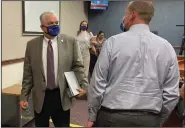  ?? More photos at arkansason­line. com/628governo­rs/
(AP/Samuel Metz) ?? Nevada Gov. Steve Sisolak (left) leaves a news conference in Carson City last week after announcing that Nevada would join California, Washington and North Carolina in requiring people to wear masks in public places.