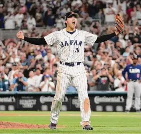  ?? Eric Espada/Getty Images ?? World Baseball Classic MVP Shohei Ohtani celebrates after helping Japan to its record third WBC championsh­ip and first since 2009.