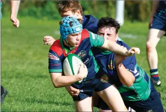  ?? ?? Clogher Valley’s Daniel Loane eventually gets stopped by the Monaghan centre.