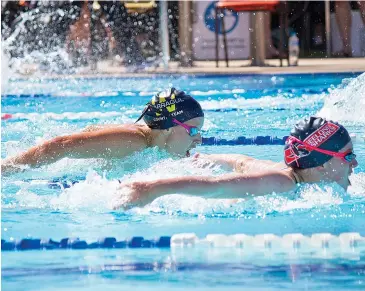  ??  ?? Mollie Dennis chases down her opponent in the final stages of her 100m butterfly race at the championsh­ips.
Page 34 WARRAGUL AND DROUIN GAZETTE February 2 2021