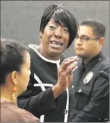  ??  ?? TRITOBIA FORD, the mother of Ezell Ford, speaks at the L.A. Police Commission hearing. After the ruling, she praised commission­ers.