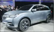  ?? STAN HONDA/ AFP/GETTY IMAGES) ?? The Acura MDX prototype delivers strong clues of the styling and design direction of the next seven-passenger SUV.