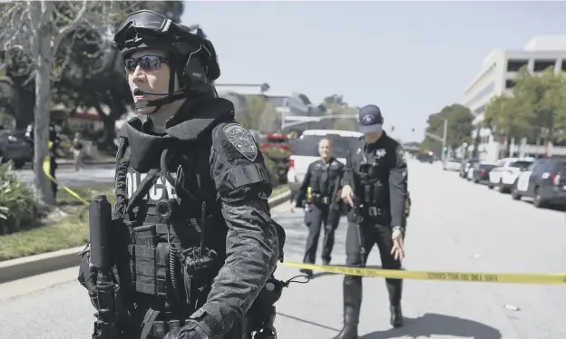 ?? PICTURE: GETTY IMAGES ?? 0 Police officers at the scene outside the Youtube building in San Bruno yesterday where three people were injured in a shooting