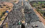  ?? Prakash Singh / AFP via Getty Images ?? KMP Expressway is blocked Saturday by farmers over India’s recent agricultur­al reforms.