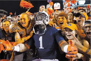  ?? AP file photo ?? Auburn wide receiver D’haquille “Duke” Williams celebrates with fans after the Tigers’ 41-7 victory over LSU last season. Williams was kicked off the team this week after reportedly punching four people at a bar last Saturday night.