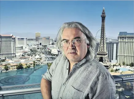  ?? David Becker For The Times ?? PAUL GREENGRASS looks over the Las Vegas Strip before a “Jason Bourne” premiere, part of a franchise he helped launch.