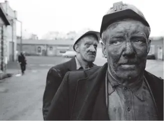  ??  ?? LIFE OF GRIME: Miners at Dawdon Colliery, Durham in 1965. John Bulmer documented life in the North of England in the 1960s and 70s as well as travelling the world as a newspaper photograph­er.