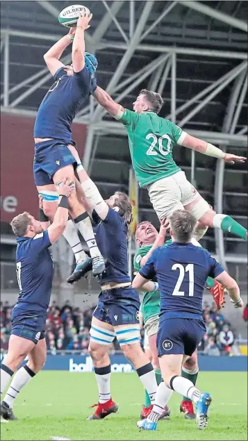  ??  ?? Scotland’s Scott Cummings flies high to win this lineout in Dublin’s Aviva Stadium