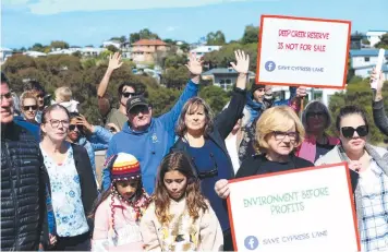  ?? ?? Residents protest against the proposed $50m Cypress Lane developmen­t (right) in Torquay in April. Picture: Mike Dugdale