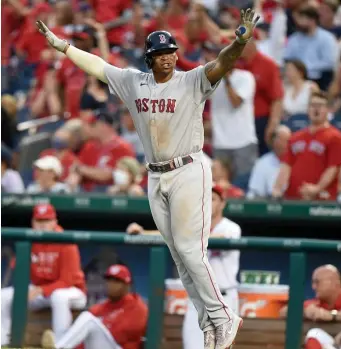  ?? Getty IMaGes; BelOw, aP ?? ‘DIDN’T GET DENIED’: Rafael Devers celebrates his game winning two-run home run during the ninth inning on Sunday against the Nationals. Below, Nick Pivetta reacts after striking out Juan Soto to finish off the victory.