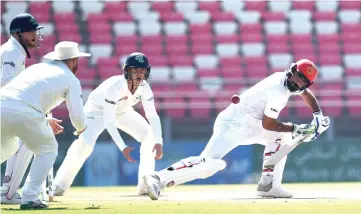  ??  ?? Afghanista­n’s Ihsanullah Janat (right) plays a shot during day four of the Test cricket match between Afghanista­n and Ireland at the Rajiv Gandhi Internatio­nal Cricket Stadium in the northern Indian city of Dehradun. — AFP photo