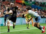  ??  ?? Mitchell Brown of the Chiefs is tackled by Caleb Clarke of the Blues during the Super Rugby Aotearoa match in Hamilton on March 27.