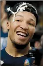  ?? AP/CHARLES KRUPA ?? Villanova’s Jalen Brunson celebrates after cutting a piece of net after the team’s victory over Texas Tech on Sunday.