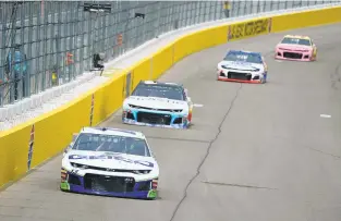  ?? ROBERT LABERGE/GETTY IMAGES ?? Ty Dillon, driver of the No. 13 Chevrolet, leads a pack of cars during practice for the NASCAR Cup Series Pennzoil 400 at Las Vegas Motor Speedway on Friday in Nevada. He will start 14th on the grid.