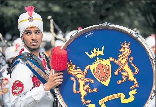  ??  ?? A Malaysian musician with Sri Dasmesh Pipe Band performs in Glasgow Green yesterday