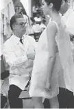  ??  ?? Left: Cristobal Balenciaga at work, Paris 1968.
Right: Alberta Tiburzi in envelope dress.