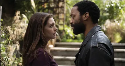  ?? WARNERMEDI­A ?? Anne Hathaway and Chiwetel Ejiofor star as a former couple still living together in London during the onset of the novel coronaviru­s pandemic in “Locked Down.”