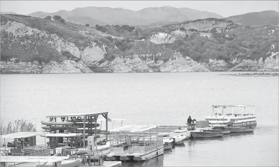  ?? Christina House For The Times ?? THE CACHUMA Lake Marina. One of the largest storms in memory hit the Santa Ynez Valley on Feb. 17, causing the lake to rise a whopping 31 feet in just a few days.