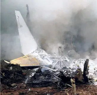  ?? ?? AT THE SITE of the crashed Air India Express aircraft in Mangaluru airport on May 22, 2010. The court of inquiry headed by Air Marshal B.N. Gokhale, former Vice Chief of the Air Staff of the Indian Air Force, determined that the crash was a result of pilot error.