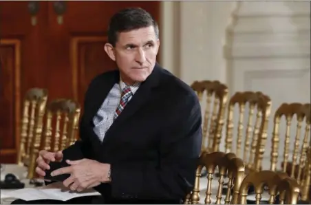  ?? CAROLYN KASTER — THE ASSOCIATED PRESS FILE ?? Then-National Security Adviser Michael Flynn sits in the East Room of the White House in Washington. Documents released by lawmakers show Flynn, now former national security adviser, was warned when he retired from the military in 2014 not to take...