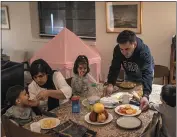  ?? DAVE SANDERS — THE NEW YORK TIMES ?? Victoria Farhadi, her husband Najib Arsalan and their children, who fled together from the Taliban in Afghanista­n, in their apartment obtained through a migrant resettleme­nt program, in Ossininga, N.Y., Feb. 10.