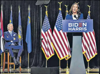  ?? AFP ?? Democratic presidenti­al candidate Joe Biden looks on as his running mate Kamala Harris speaks during an event in Wilmington, Delaware, on Thursday.