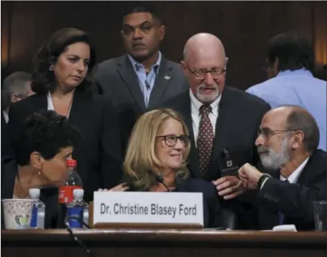  ?? ASSOCIATED PRESS ?? Christine Blasey Ford and her attorneys Debra Katz, foreground left, and Michael Bromwich, foreground right, take a break during testimony before the Senate Judiciary Committee Thursday in Washington.