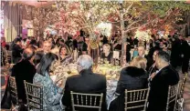  ??  ?? Guests enjoyed Japanese cuisine amid blooming cherry trees for spring at the gala.