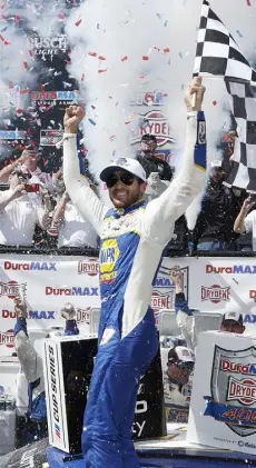  ?? Sean Gardner, Getty Images ?? Chase Elliott celebrates in victory lane after winning the NASCAR Cup DURAMAX Drydene 400 at Dover Motor Speedway on Monday.