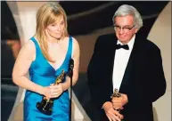  ?? Kevin Winter / Getty Images ?? Novelist and screenwrit­er Larry McMurtry accepts his Oscar for “Brokeback Mountain” with co-writer Diana Ossana at the 2006 Academy Awards. McMurtry died Thursday at the age of 84.