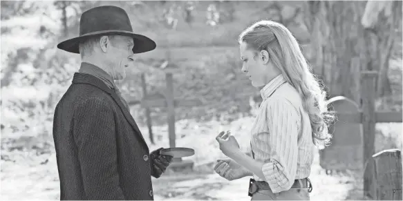  ??  ?? Man in Black (Ed Harris) may rue the day he met android host Dolores (Evan Rachel Wood), who is beginning to fight her ill treatment in “Westworld.”