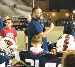  ?? KEITH GROLLER/THE MORNING CALL ?? Liberty football coach Shawn Daignault addresses his team on the field at Bethlehem Area School District Stadium after a 46-13 win over East Stroudsbur­g North. The Hurricanes have started a season 2-0 for the first time since 2019 and matched their win total from last season.