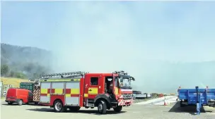  ??  ?? A fire engine at the scene near Llwydcoed