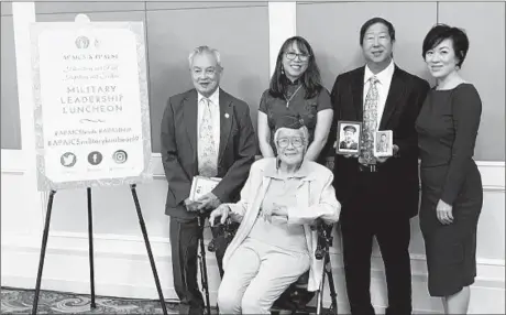  ?? APAICS AND ANDY WONG/HANDOUT ?? Clockwise: Robert M. Lee, US Army Air Force (WWII Vet); Maria Wong; Andy Wong (holding photos of father Hugh Wong and uncle Howard Wong); Madelene Mielke, president and CEO of APAICS; and Elsie Seetoo, US Army Nurse Corps (WWII Vet) at APAICS Military Leadership Luncheon.