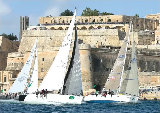  ??  ?? Yachts jostle for position at the start of the Rolex Middle Sea Race in Grand Harbour yesterday morning. Photos: Jonathan Bugeja