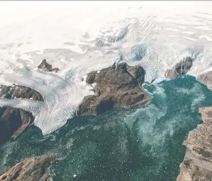  ?? JEREMY HARBECK/AFP/GETTY IMAGES ?? Jon Gertner’s new book details the increasing and alarming rate at which Greenland has been losing ice.