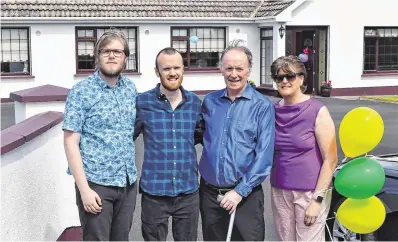  ??  ?? ‘Doing fantastic’:
Dónal Lawlor arriving home in Irishtown, Co Westmeath, after his Covid-19 ordeal, with wife Aileen and sons Colm and Éamonn