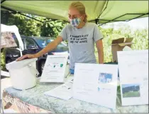  ?? Tyler Sizemore / Hearst Connecticu­t Media file photo ?? A Waste Free Greenwich booth in June 2020 at the Old Greenwich Farmers Market selling home composting starter kits. Greenwich has signed on to the new Connecticu­t Coalition for Sustainabl­e Materials Management.
