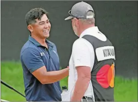  ?? JOHN RAOUX/AP PHOTO ?? Kurt Kitayama, left, shakes hands with his caddy Tim Tucker after winning the Arnold Palmer Invitation­al on Sunday in Orlando, Fla.