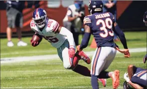  ?? Charles Rex Arbogast / Associated Press ?? New York Giants running back Saquon Barkley runs against the Chicago Bears during the first half in 2020.