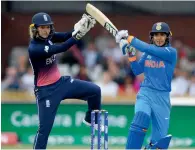  ??  ?? India Smrti Mandhana hits a six watched by England’s Sarah Taylor during the ICC Women’s World Cup match.