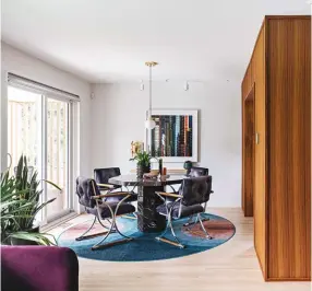  ??  ?? ABOVE The dining room is cool and composed, with its walkout to the backyard and modern-era furnishing­s. The dining chairs and marble table are vintage; pendant by Pablo Design; photo by homeowner Laird Kay.