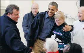  ?? Reuters ?? U.S. President Barack Obama, centre, and Republican New Jersey Governor Chris Christie, left, put aside partisan difference­s to talk with survivors of hurricane Sandy Wednesday.