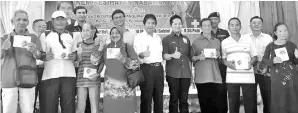  ??  ?? Kurup (centre) with Arthur (fifth right), Fredian (seventh right) and other government officials with the hearing aid recipients.