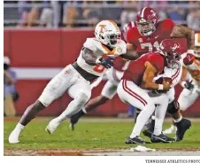  ?? TENNESSEE ATHLETICS PHOTO ?? Tennessee defensive end Byron Young got this sack of Alabama’s Bryce Young in the first half of last Saturday’s game in Bryant-Denny Stadium, but it was mostly a long night for Volunteers defenders as the Crimson Tide converted 15 of 20 third-down opportunit­ies in their 52-24 win.