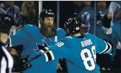  ?? JOSIE LEPE — BAY AREA NEWS GROUP, FILE ?? Former Shark Joe Thornton (19) celebrates with Brent Burns (88) during their 2017 game against the Canucks at SAP Center in San Jose.